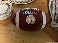 Side view of the Wilson football showing the Grey Cup 101 emblem and Wilson branding.