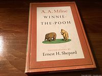 Front cover of 1961 hardcover Winnie-The-Pooh by A.A. Milne with illustration of Pooh and Piglet