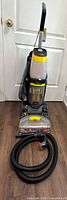 Full front view of upright carpet cleaner