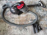 Overall view of Dyson Big Ball canister vacuum assembled with hose, wand, and motorized floor head on rug