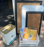 Paper shredder Royal Platinum Series PX1000MX, corkboards, and whiteboards standing behind a plastic bin full of assorted clipboards and paper.