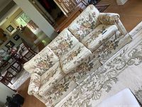 Front angle view of the 3-seat floral sofa showing removable seat and back cushions, floral pattern, and armrests.