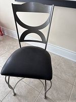 Front-left view showing chair frame, seat cushion, and backrest design