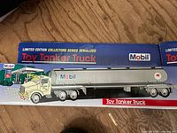 Boxed Mobil branded toy tanker truck with detailed tanker trailer, part of limited edition collectors series