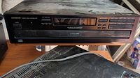 Front view of the Onkyo DX-C330 with minor wear and visible display and control buttons.