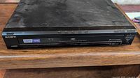 Front view of a black Sony DVP-NC85H DVD/CD player showing disc tray, HDMI and logos.