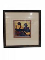 Framed square art print showing two women with backs turned to viewer within a dark wood frame.