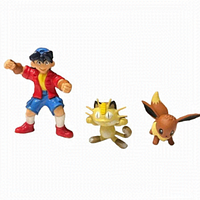Photo showing all three figures: boy character, Meowth, and Eevee, positioned side-by-side on white background.