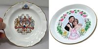 Photo of two vintage commemorative bone china trinket plates, one with Charles and Diana wedding imagery, the other with Charles, Diana and Prince William.