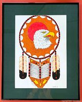 Framed and matted mixed media drawing featuring a Native American inspired eagle design with feathers and chest plate accents.