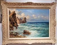 Frontal view of entire framed painting with carved wood frame