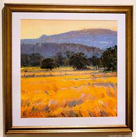 Full front view of framed painting showing landscape scene and gold-tone frame