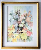 Full view of framed watercolour painting depicting autumn foliage, green apples, pine cones and branches in soft colors, signed lower left.