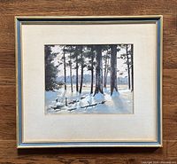 Framed entire painting showing the snowy forest scene with gold frame and mat.