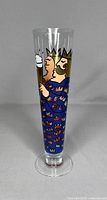 Front view of the King design on a pilsner beer glass showing the cartoon crowned King in blue attire holding a beer mug.