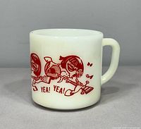 Front view of vintage Federal milk glass mug with red cartoon Beatles Fab Four illustration and YEA! YEA! text.