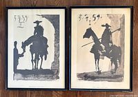 Photo of two framed Picasso lithographs side by side, showing bullfighters on horseback in black silhouettes.