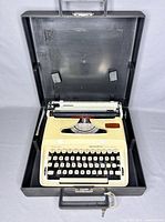 Full view of Remington Ten Forty typewriter placed inside open carrying case showing interior lid and base with typewriter secured.