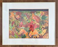 Framed watercolour art showing autumn leaves in various colors, matted and signed lower left.