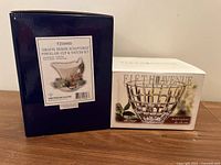 Boxes for Franz Porcelain giraffe cup & saucer and Fifth Avenue Crystal bowl showing brand, model, and product details.