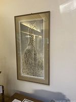 Frontal view of the framed print on wall showing full artwork and frame condition