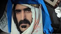 Front cover of Sheik Yerbouti vinyl album featuring Frank Zappa's face with a white head covering.