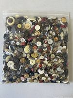 Full resealable bag filled with assorted vintage buttons showing mixture of colors and materials.