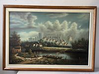 Front view of the framed oil painting showing a lush countryside scene with river, livestock, houses, and castle in background under cloudy sky.