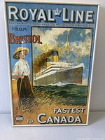 Framed vintage Royal Line steamship advertising poster showing a ship at sea and a woman on the shore.