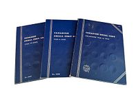 Three blue Whitman coin folders front covers