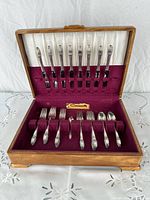 Open case showing full 24-piece flatware set