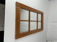 front view showing wood frame and six mirrored panes