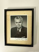 Entire framed photograph showing image, mat, and frame