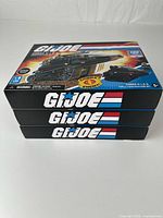 Stacked view of three G.I. Joe construction set boxes