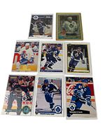 Front view of eight Wendel Clark hockey cards including cased Premier Finest and seven sleeved cards