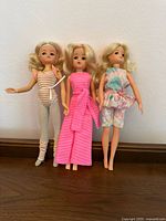 Front view of three vintage Sindy dolls in assorted outfits