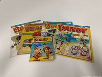 Front covers of all five comic books displayed