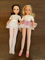 Front view of both dolls showing outfits and height