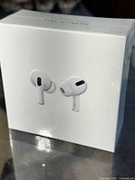 Front of sealed retail box showing image of AirPods Pro