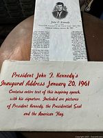 Photo showing the red text promotional cover indicating the speech text, Kennedy's signature, and included pictures of the President, the Presidential Seal, and American Flag.