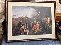 Full view of framed artist print showing the entire artwork and frame hung on a textured wallpapered wall.