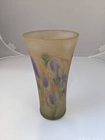 Front view of the handmade vintage glass vase showing the floral decoration and shape.