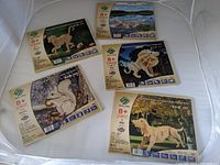 Overview photo of all 5 wooden craft kits showing packaging with animal illustrations and age recommendations.