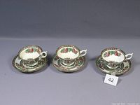 Three Coalport Indian Tree coffee cups placed on matching saucers with intricate floral patterns all in very good vintage condition.