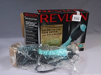 Revlon Pro Collection Salon One-step Hair Dryer and Volumizer in original box with some wear, tool wrapped in plastic.
