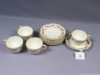 Four set of Royal Worcester FERNCROFT coffee teacups and saucers arranged with identifier card