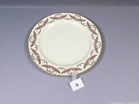 Front view of the Royal Worcester large cake chop plate showing the pink ferncroft pattern around the rim.