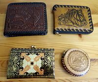 Top view of all four leather items: two wallets and two change purses.