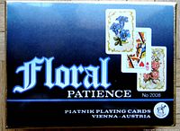 Box front showing the Floral Patience logo No 2008 and example playing cards with floral backs