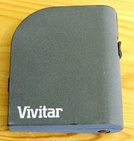 Closed black plastic folding case with Vivitar logo visible.
